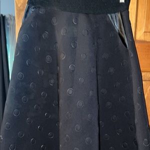 Black A line boutique skirt with pockets. Below knee length. Never worn. Size m